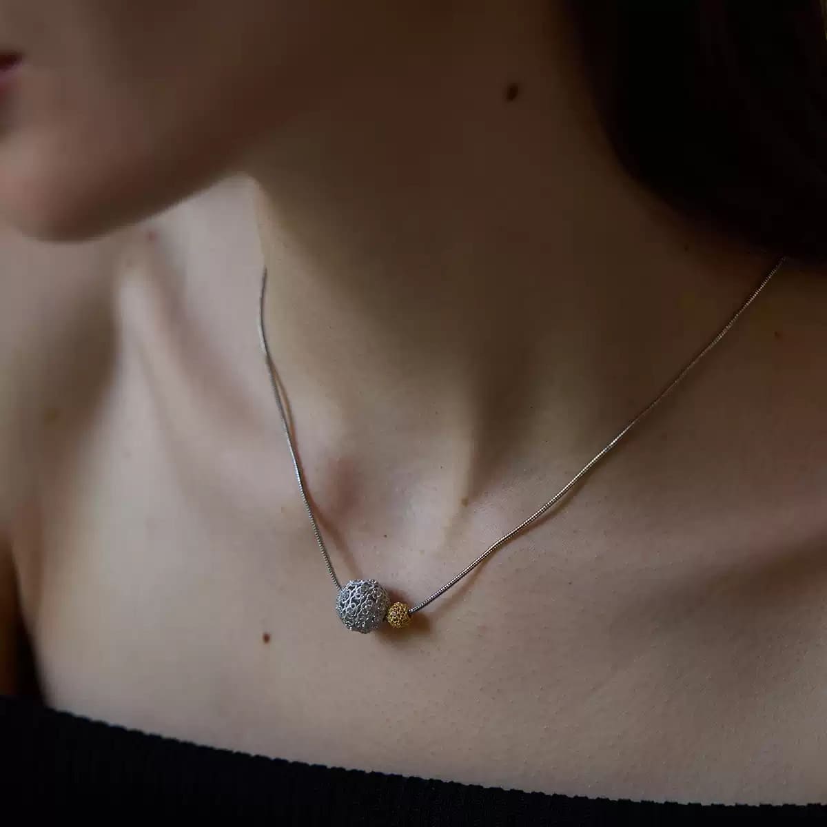 gold-tone-hollow-sphere-necklace